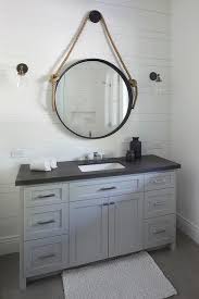Bathroom Black And White Granite Countertops Exquisite Cottage Bathroom Boasts A White Bath Mat Placed In Front Of A Steel Gray Washstand Accented Black Granite Countertops Cottage Bathroom Bathroom Decor