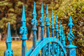 Beautiful wrought iron gate over looking a vineyard on a hillside. 43 Amazing Fence Gate Ideas