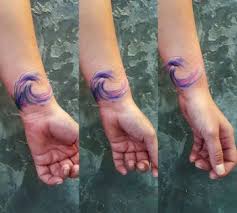 It's cute and stylish at the same time! Watercolor Wave Tattoo On The Wrist Tattoogrid Net