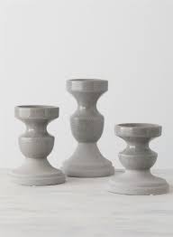 Display your candles on this iron pillar candle holder with an antique gold finish. Set Of 3 Gray Ceramic Pillar Candle Holders Wilford Lee Home Accents