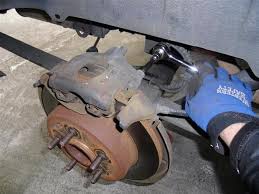 If you're not experienced with vehicles, you may not realize there are two different types of brake calipers. How To Change Rear Disc Brakes On A 2001 Chrysler Town Country Minivan Auto Maintenance Repairs Wonderhowto