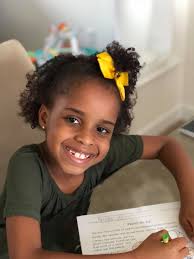 My daughter hears all the time how much she looks like Hannah Stuelke, so  she finally agreed to wear her hair in puff buns today for Athletes Vs  Farmers Day for homecoming." #