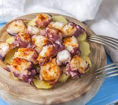 This dish is prepared by first boiling the octopus inside a copper cauldron. Pulpo A La Gallega Foodwiki Takeaway Com