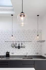While diy kitchen splashback installation is a cheap option, you should make sure you have the necessary skill to install the type of tile you choose. Tiles Concrete Work Surface And Matt Black Cabinets Kitchen Splashback Tiles Kitchen Splashback White Kitchen Splashback