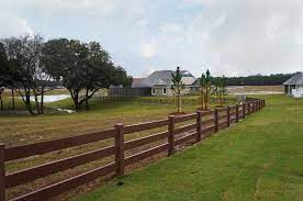 Midland vinyl fence offers many varieties of vinyl fencing. 3 Rail Brown Vinyl Ranch Fence Ranch Fencing Vinyl Railing Wood Grain Vinyl Fence