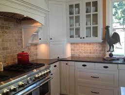 The primary colors match the sleek, seamless white drawers and appliances on one wall contrast with black lower cabinets. Cool Stainless Steel Countertop Design 99da Beige Wooden Laminate Floor Wh Backsplash Kitchen White Cabinets White Cabinets Black Countertops Black Countertops