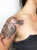 What does a dragon tattoo mean on a woman?