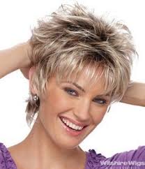 She went for a platinum long pixie spiked with a little beige blonde meant to bring out and mirror the color of her skin. Short Shag On Pinterest Short Hair Pictures Short Hair With Layers Short Layered Haircuts