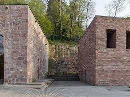 max dudler creates restaurant inside heidelberg castle s saddle room sandstone wall heidelberg castle