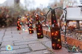 23 Ingenious Ideas To Transform Old Glass Bottles Into Extravagant Lamps Hanging Christmas Lights Decorating With Christmas Lights Outdoor Christmas Lights