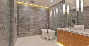 The brown primary bathroom features a wooden vanity and a deep soaking tub by the glass block windows. 10 Cool Bathtub Enclosure Ideas For Your Bathroom
