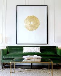 Room Decor Ideas A Simplistic Living Room With White Walls And A Glass Coffee Table The Different Touch Is Give Green Sofa Green Velvet Sofa Couch Upholstery