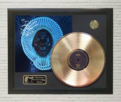 He has clearly absorbed a great deal of musical history, as the album nods to. Childish Gambino Awaken My Love Framed Signature Gold Lp Record Display M4 Gold Record Outlet Album And Disc Collectible Memorabilia