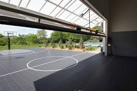 Outdoor Basketball Hoop Home Gym Transitional With Garage Door Indoor Outdoor Basketball Cou Home Basketball Court Outdoor Basketball Court Indoor Sports Court
