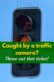 A man and woman reading a speeding. Caught By A Traffic Camera Throw Away That Ticket I Pick Up Pennies