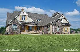 The charming exterior textures of stone and shake siding give this home great curb appeal. Rustic Craftsman House Plans Split Bedroom Floor Plans
