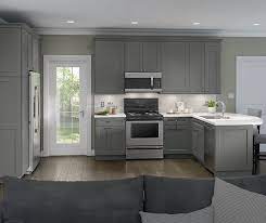 Celery green walls tie it all together for a serene space to practice the culinary arts. Gray Casual Kitchen Cabinets Homecrest