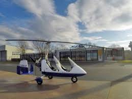 Flygplan rotor luftfart flygande autogiro parkerat helikoptrar rotax gyrokopter. Gyrokopter Hannover De