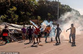 Busty milf seducing a teen blonde lesbian. Four Young Afghan Men Charged With Arson After Enormous Blaze At Lesbos Migrant Camp Daily Mail Online