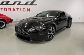 Image result for Jet Black 2011 Aston Martin