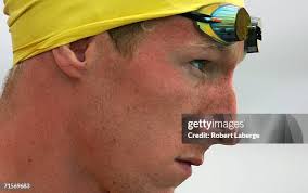 Justin Mortimer gets ready for his heat in the men's 200 meter... News  Photo