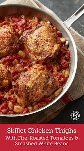 Skillet Chicken Thighs With Fire Roasted Tomatoes And Smashed White Beans Recipe Easy Chicken Dinners Recipes Fire Roasted Tomatoes