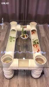 The table is equipped with a useful lower shelf that delivers one drawer and one open cubby at its center. Unilad Fish Tank Coffee Table Facebook
