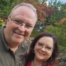 What is the location of the beautiful beach in the Cayman Islands?