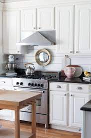 Using a plain white shiplap ceiling design helps tone down the dark shiplap kitchen backsplash. Kitchen Update Shiplap Backsplash Boston Belle