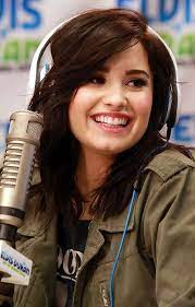 With a radiant smile and an angelic voice, demi lovato became friends with television's favorite purple dinosaur on barney and friends at age 7 — but the twinkle in the starlet's eyes went out when the lights on set did. Demi Lovato Photos Pictures Of Demi Lovato Demi Lovato Live Demi Lovato Young Demi Lovato Heart Attack