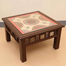 Your succulents and cool coffee table books can't wait to meet the stylecraft badang carving natural teak coffee table. Moorni Teak Wood Center Cum Coffee Table With Warli And Dhokra Work In Walnut Brown Center Tables Tables Furniture Shop In Dubai Uae Www Moorni Com
