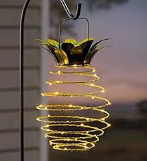 Amazon Com Plow Hearth Solar Hanging Pineapple Outdoor Lantern With White Led Lights Bouncing Coil Design Lanterns Decor Pineapple Lights Pineapple Decor