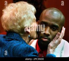 Nathaniel Abraham receives a kiss from Elaine Rosati, a court appointed  guardian, after being released from all state supervision Thursday, Jan.  18, 2007, a day before his 21st birthday in Oakland County