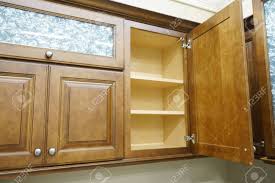 wooden kitchen cabinet with door open