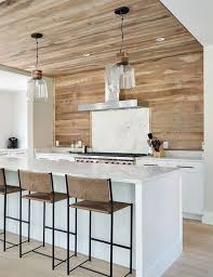 Topped with a speckled white quartz countertop and modern barstools, the backsplash also adds texture to this kitchen with its cracked white surface. 25 Wooden Kitchen Backsplashes That Stand Out Shelterness