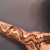 This dragon henna tattoo would have looked even better if made in whole style. 1