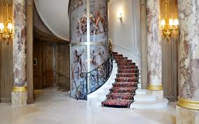The Ritz Hotel In Paris France S Glass Elevator Stairs The Circular Elevator Features Drawings Inspired By Battle Scenes Much Like The Famous Place Vend