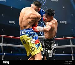Hiroto Kyoguchi (red gloves) of Japan knocks down Jerven Mama (blue glives)  of the Philippines compete their 10R flyweight boxing bout at Korakuen Hall  in Tokyo, Japan on September 22, 2023. (Photo