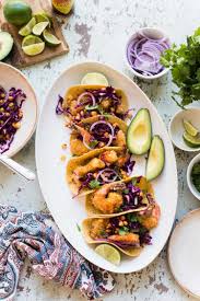 Easy to make with homemade pickled pineapple relish, cabbage slaw with avocado cream, and baja style fried fish all wrapped in a warm gluten free tortilla! Oven Fried Crispy Shrimp Tacos With Quick Pickled Cabbage Kitchen Confidante