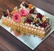 From designer alphabet letter cake to fondant alphabet cake, we bake them without eggs as and when the customer demands it. Tart Cake In The Alphabet V White Cherry S Hyderabad Facebook
