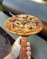 That Traegergrills New Giant Spatula Came In Handy Pulling The Pizza Of My Traeger Also My Traeger Pizza Kit Worked Pizza Stone Traeger Grill Traeger Pizza