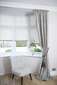 In this article, you'll be able to see dozens of window treatments for a variety of rooms, complete with helpful pictures to capture the essence of. Dressing A Square Bay Window Google Search Bay Window Living Room Curtains Living Room Living Room Blinds