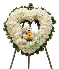 Discover ideas for celebrating your continuing connection on special dates and holidays, and in those quiet moments. Hearts Open Wreath At From You Flowers