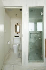Many different items are stored in this closet. Small Bathroom And Walk In Closet Designs Novocom Top