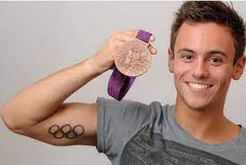 The diving hero caused a stir among olympic tv viewers up early to watch the women's 3m springboard final on. Tom Dailey Team Gb Tom Daley Ring Tattoos Olympic Rings