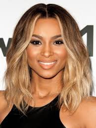 Back view of a woman with long straight black hair. Middle Part Blonde Wavy Human Hair Wigs For Black Women