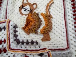 Would like to request a commission order or have a question then please use the 'contact designer' icon or email eileenscraftstudio@virginmedia.com. Unique Crochet Baby Blanket Cream Brown Mustard Tabby Cat Design