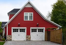 This Red Side Facing Garage Features Two Car Carriage Style Doors In White Wood With Upper Pan Garage Door Design Residential Garage Doors Garage Door Styles