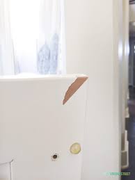 Press the vinyl back down on the cabinet and keep it in place with masking tape until the glue has dried. How To Paint Thermofoil Cabinets Life On Virginia Street