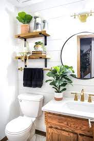 The ceiling and floor covered with white square tiles are paired with black textured walls that go entirely against the striking red fittings. Bathroom Decor Ideas Blog Half Full